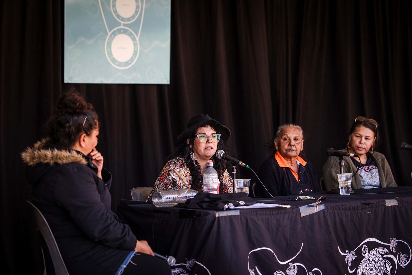 A panel session with four people at Saltwater Freshwater Festival 2024.