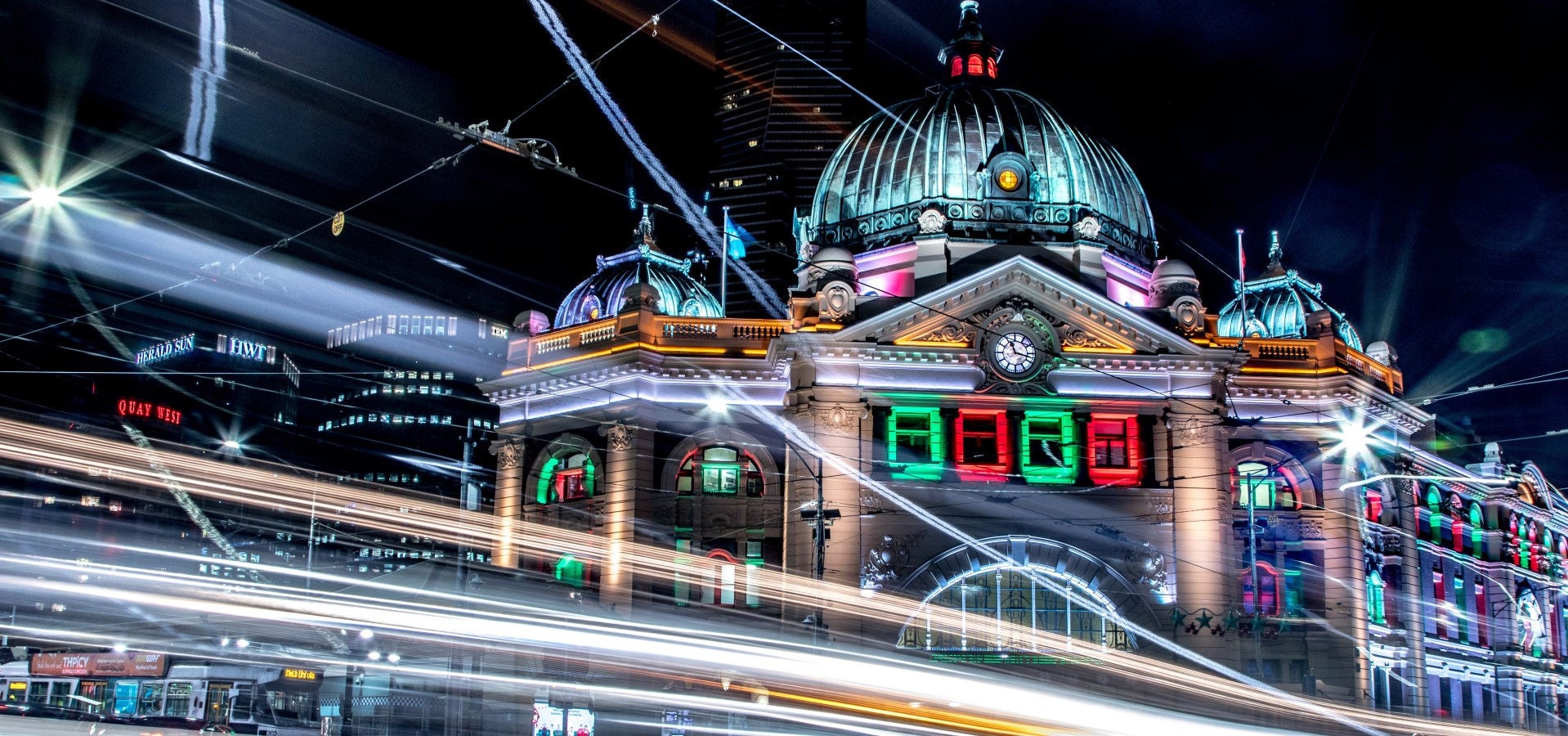 A timelapse night photo of Flinders Street Station, Melbourne